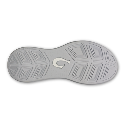 Grey and white athletic shoe sole with geometric tread pattern and centered logo.