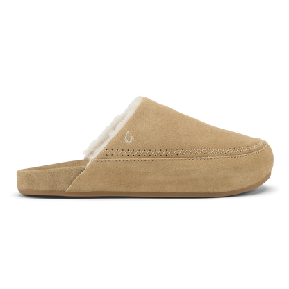 Tan suede slipper with white fleece lining and stitched seam detail along the sole.