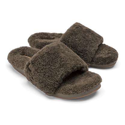 Pair of walnut-colored fleece slippers with cushioned soles and open-toe design.